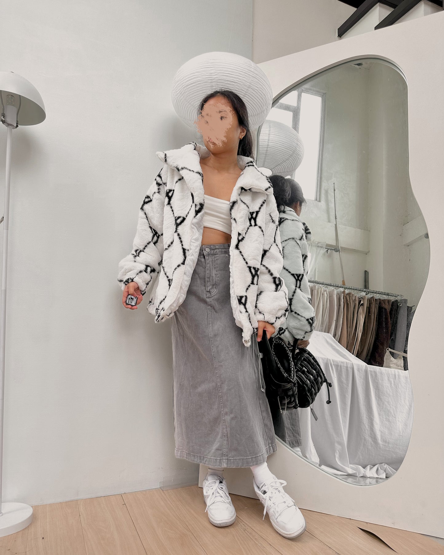 white with black details furry jacket