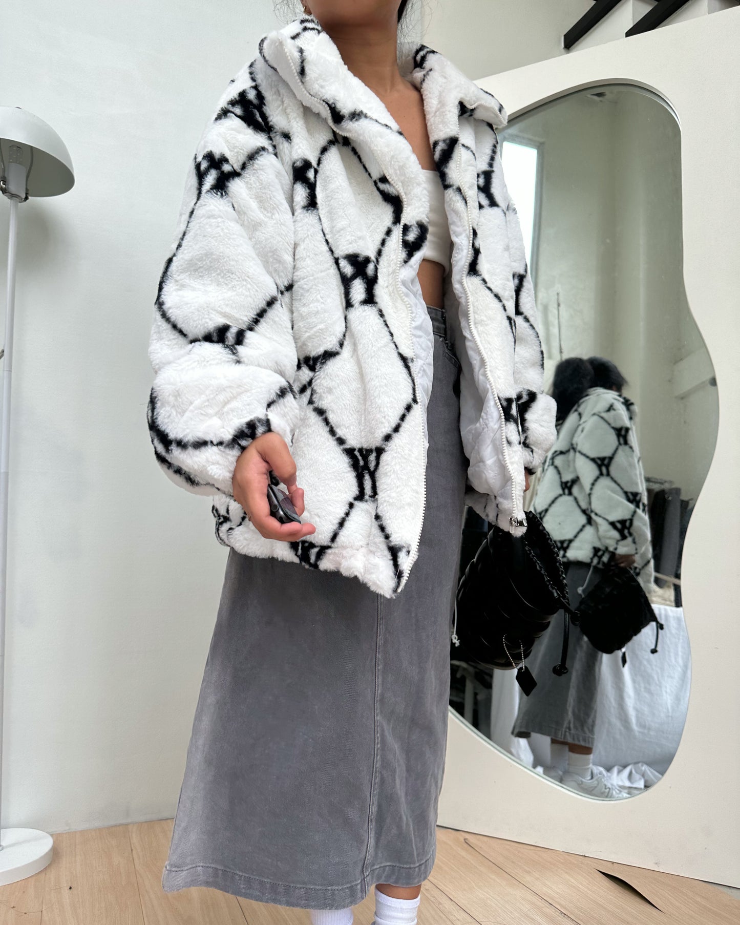 white with black details furry jacket