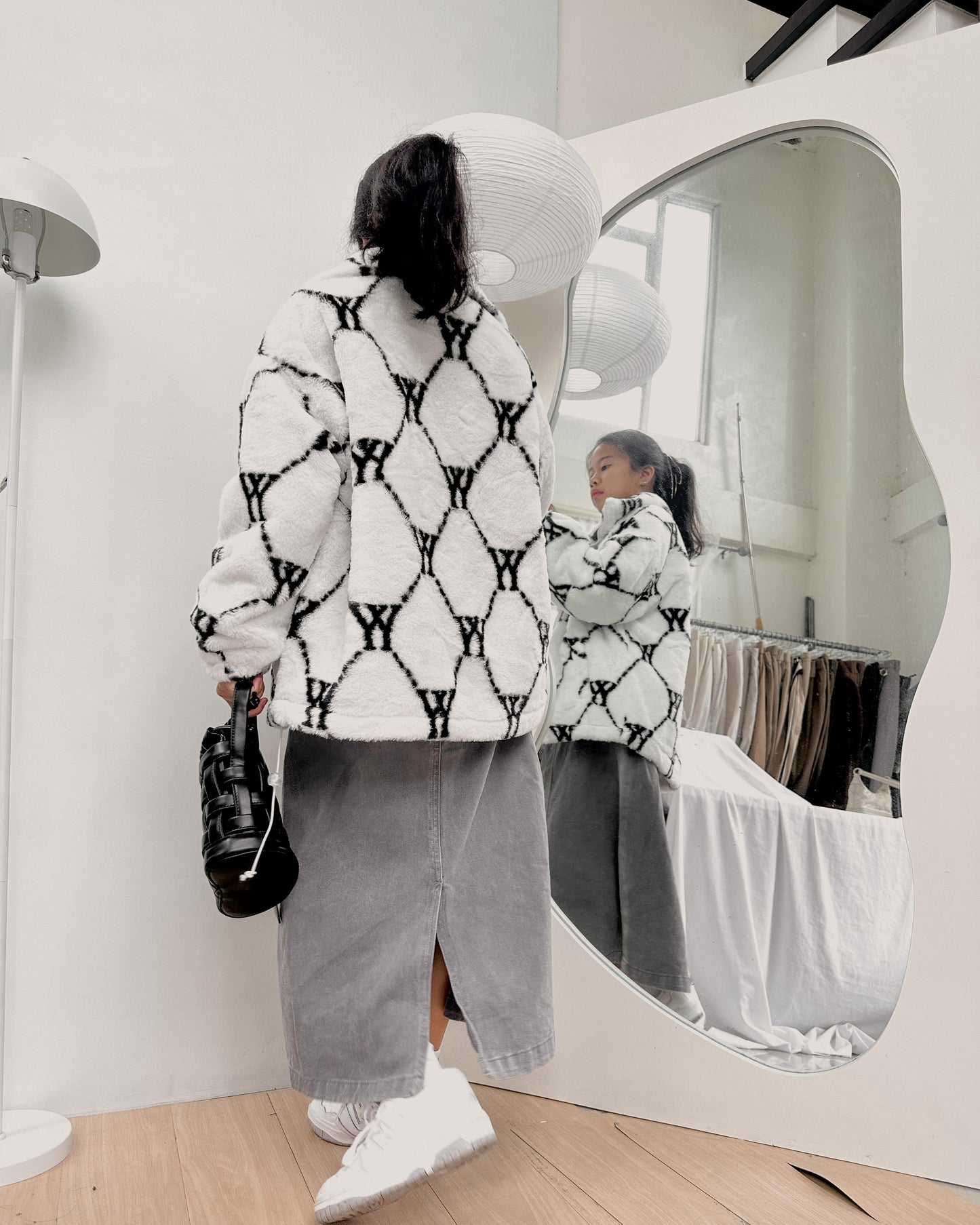 white with black details furry jacket
