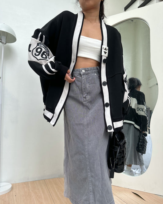 black cardigan with white details