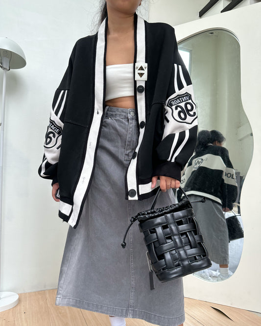 black cardigan with white details