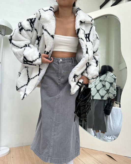 white with black details furry jacket