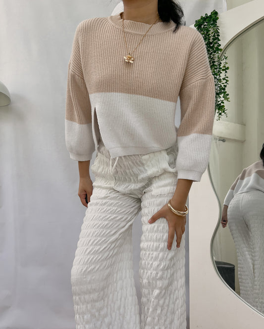 dual colored knitted pullover with side slit