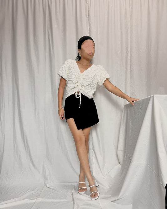 puffy white textured top with mid front ruching