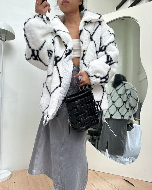 white with black details furry jacket