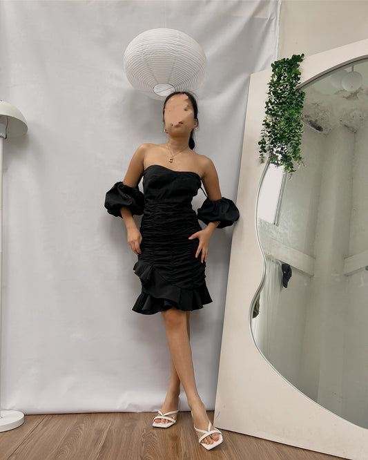 black bustier with ruching detail and puff sleeves dress