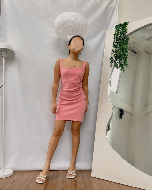 pink very flattering square neck dress with low back detail