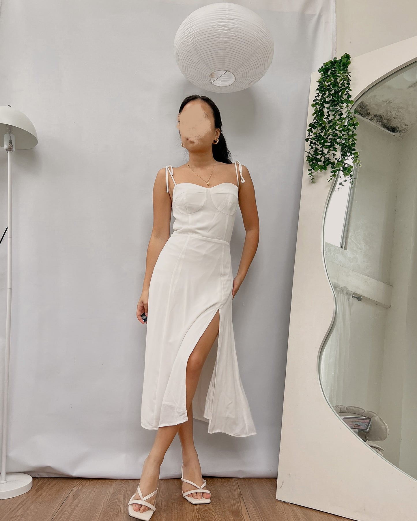white corseted like bust dress with side slit