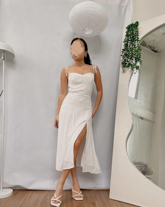 white corseted like bust dress with side slit