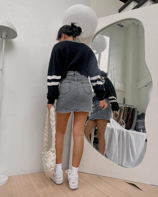 white pullover with black hemline