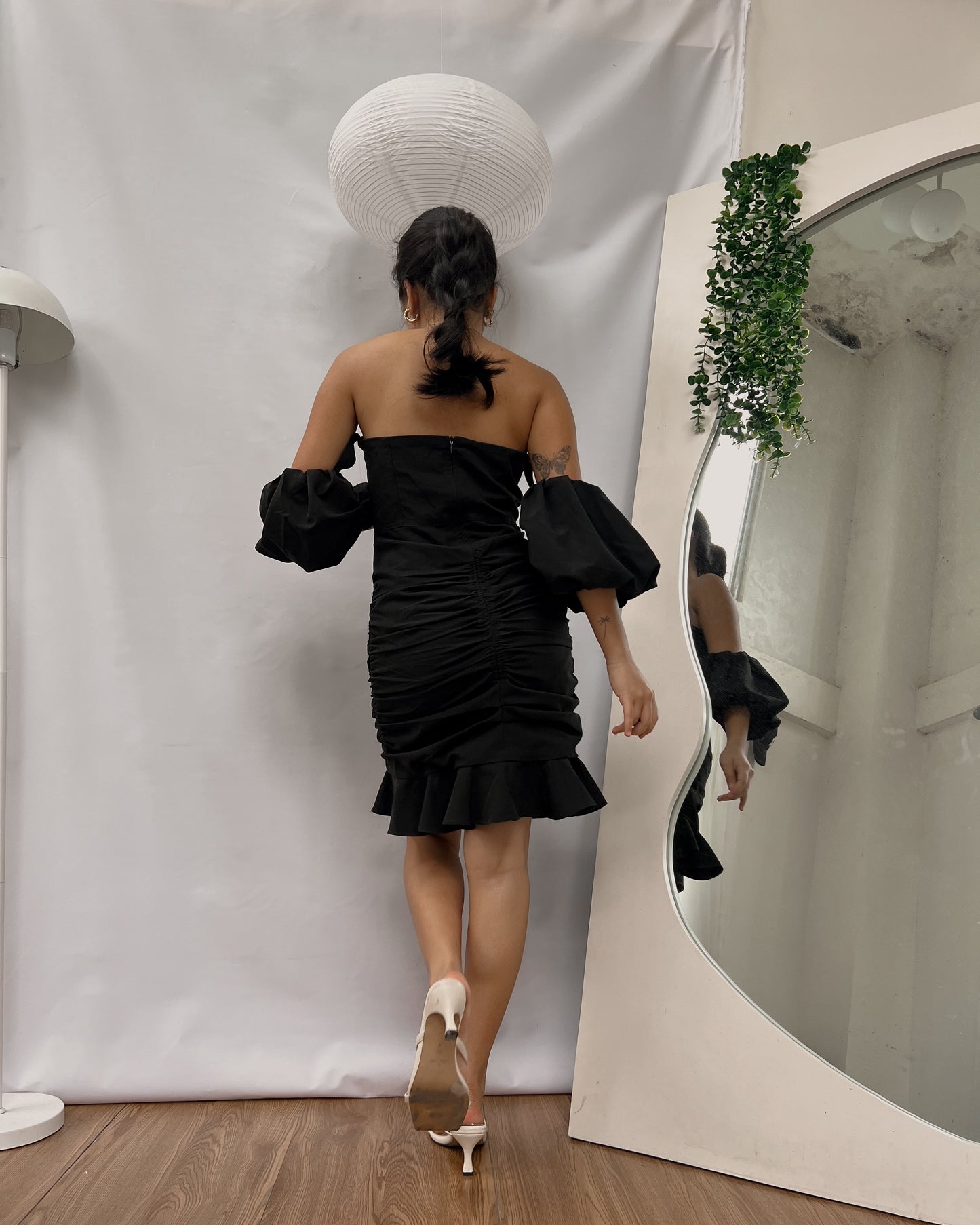 black bustier with ruching detail and puff sleeves dress