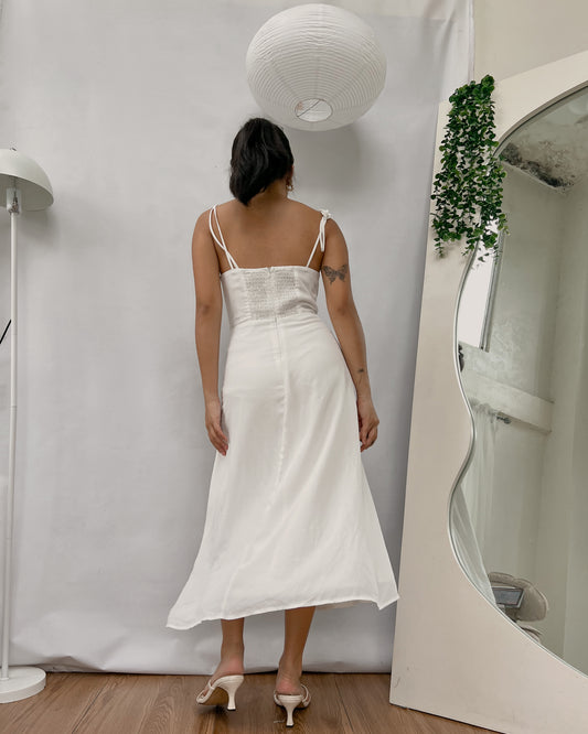 white corseted like bust dress with side slit