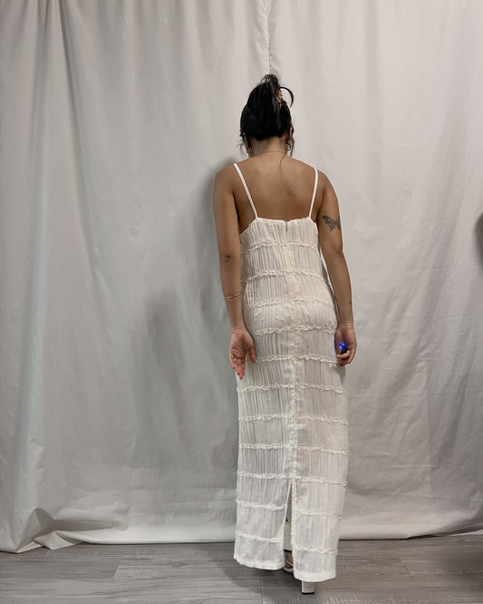 white sleeveless pleated dress with back slit