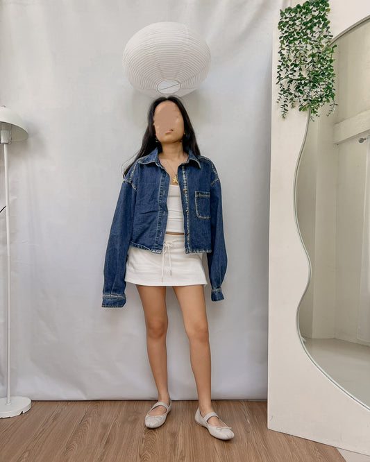 dark washed denim jacket with one pocket