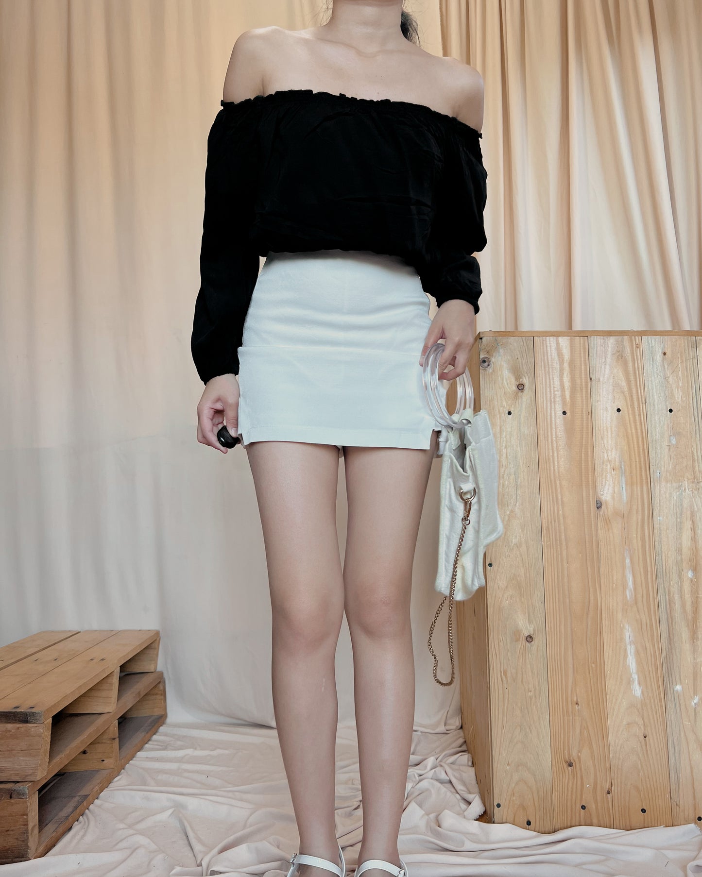 black off shoulders top with curled hemline