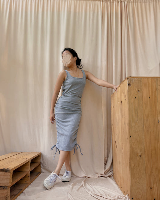 grey body hugging dress with side ruching