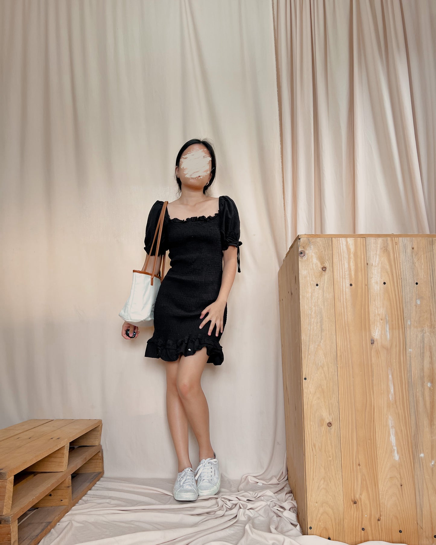 black textured body hugging dress with puff sleeves