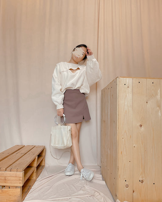 Cream pull over with open front design