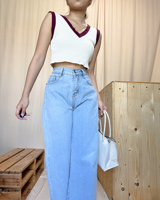 Light washed denim pants with raw hem detail  m1